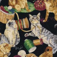 cat with yarn fabric
